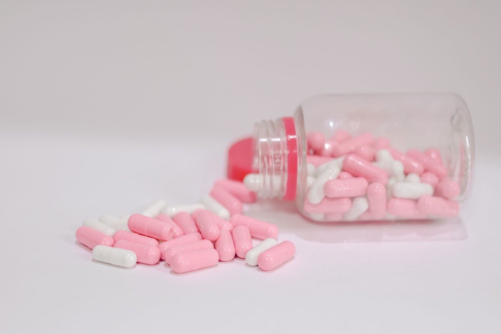 Antibiotic capsules spilled from a bottle