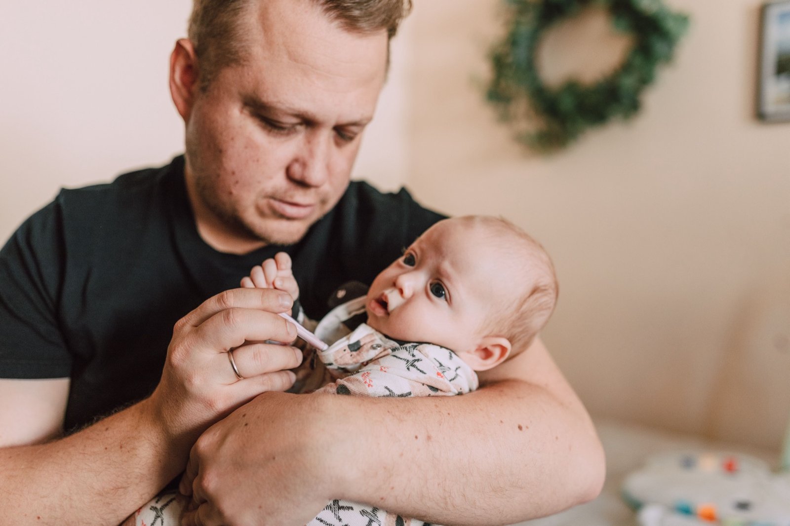 Father checking on his baby who has a stuffy nose