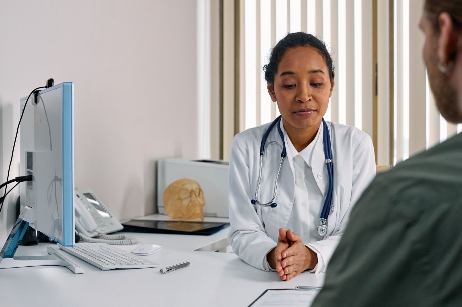 Female doctor consulting with a patient about menopause symptoms