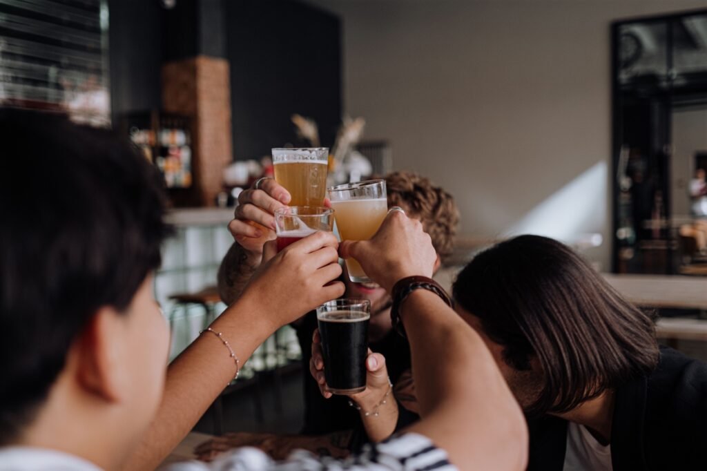 Friends raising a toast together at a bar