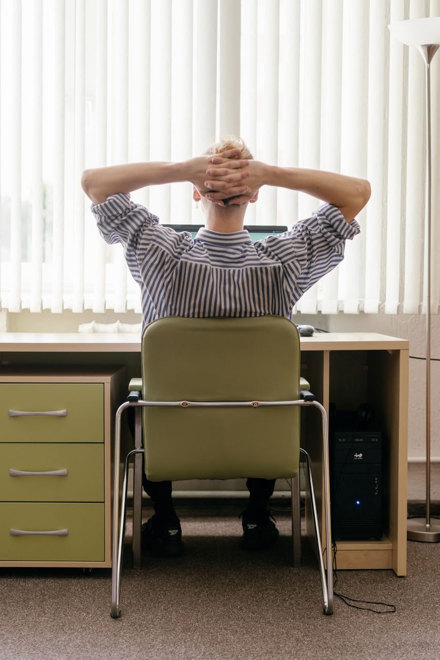 Person sitting at a desk for long periods at work