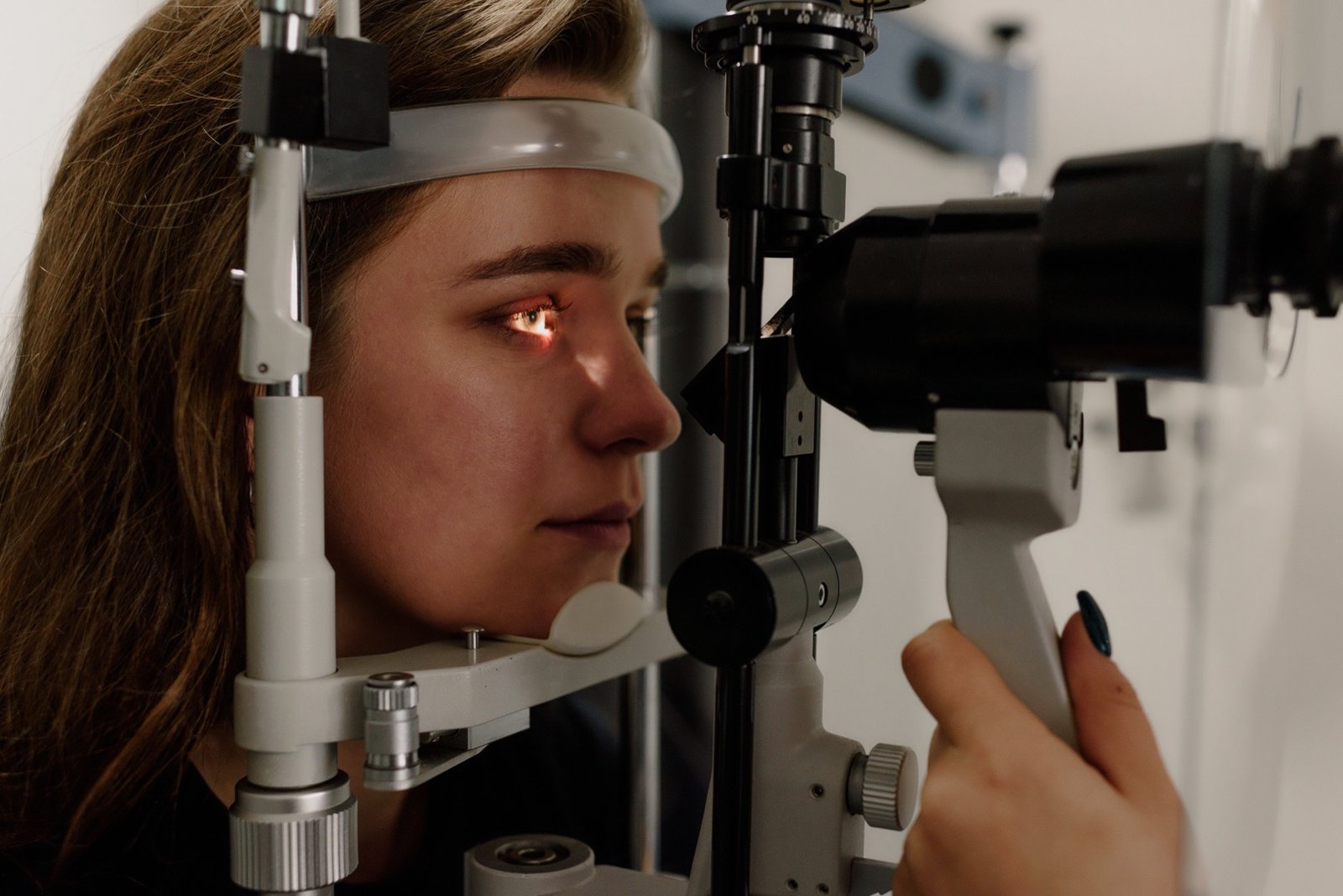 Patient having a slit-lamp eye exam to check for corneal edema