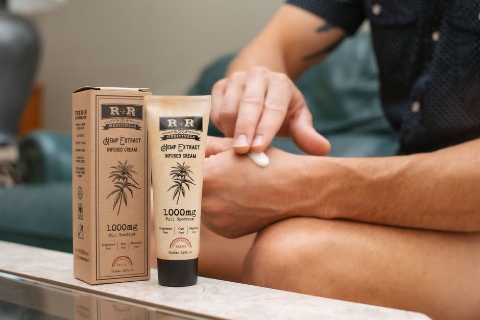 Hand applying lidocaine cream for anal fissure pain relief