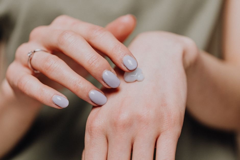 Applying skin cream for itching relief