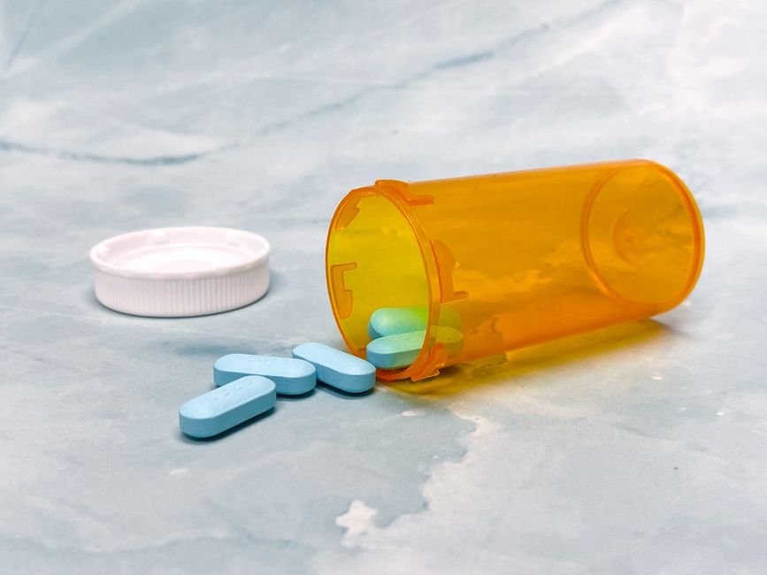 Pill bottle with tablets spilled out