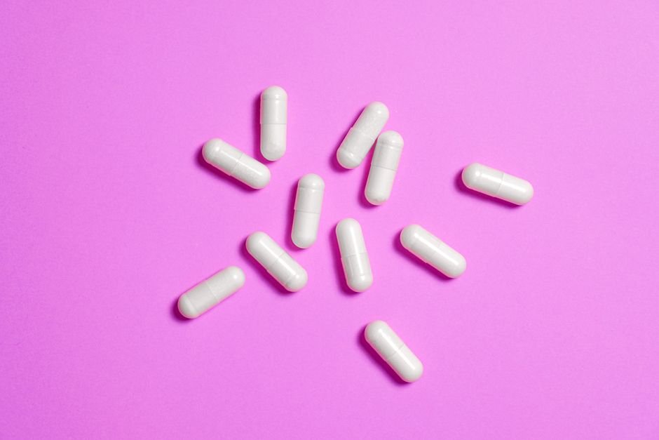 Suppository capsules on white background