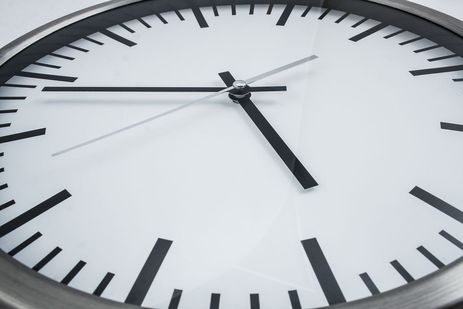 Analog wall clock close up, a reminder that Preparation H needs consistent use over hours to days