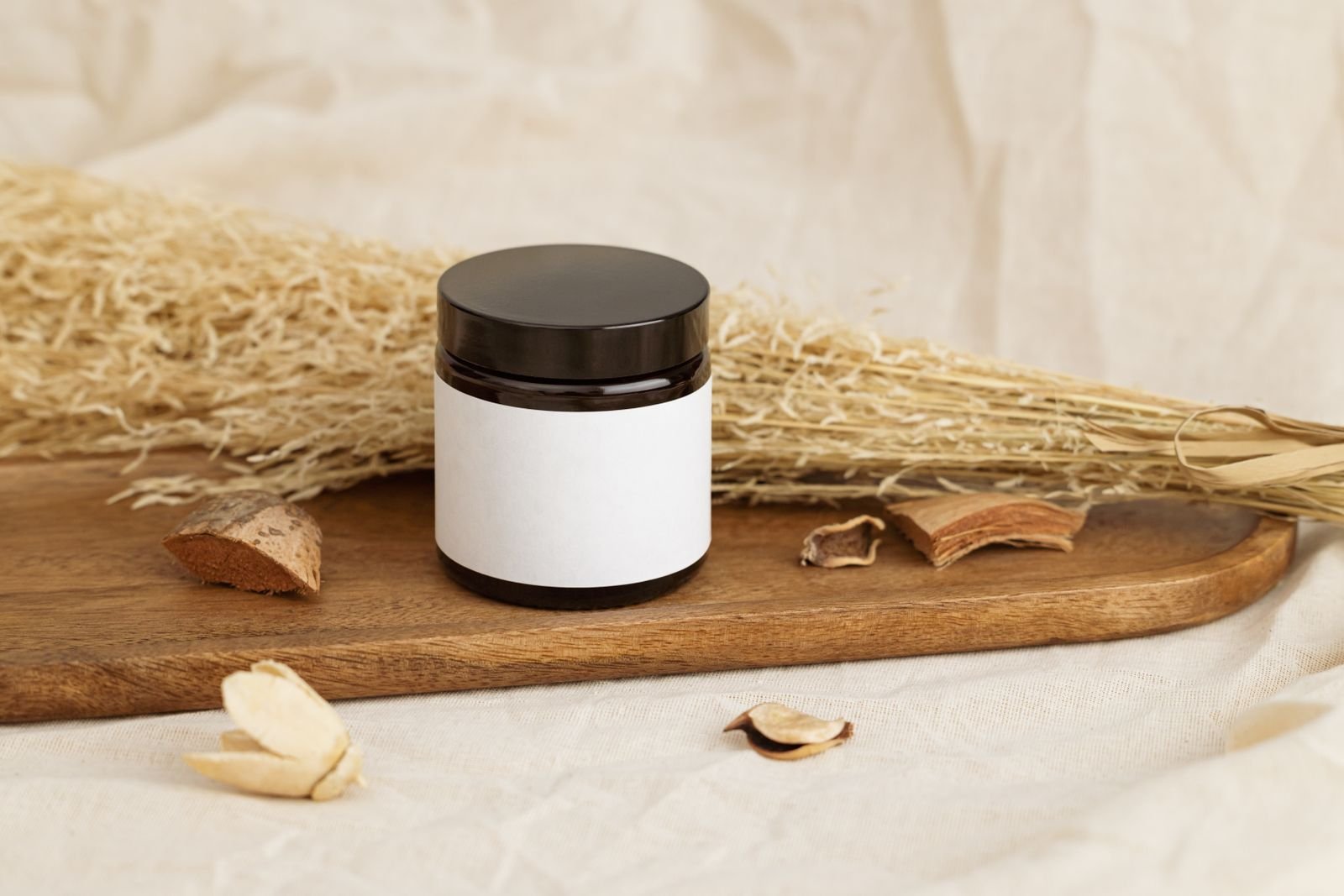 Unlabeled cream jar beside dried herbs on a wooden tray, the kind of packaging used for an herbal hemorrhoids cream