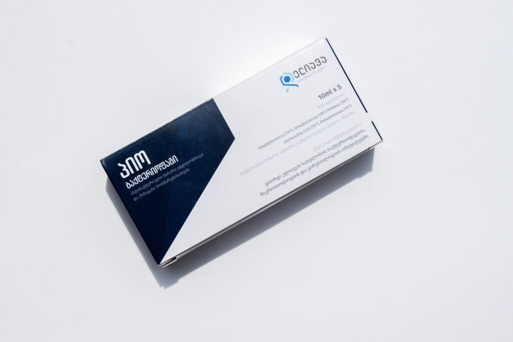 Medicine box on a white surface, a reminder to read the label before learning how to apply hemorrhoid cream